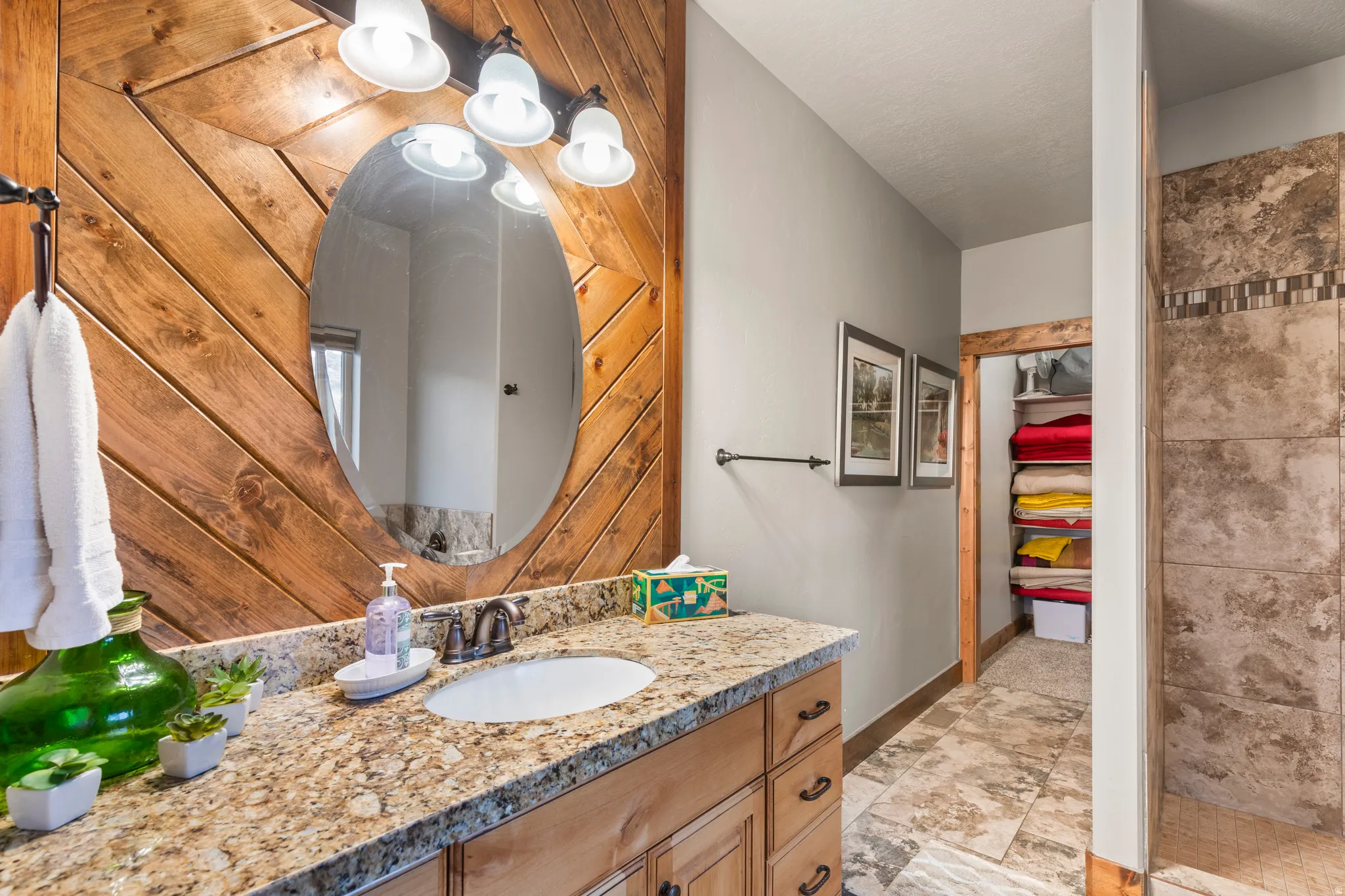 Bathroom featuring vanity and baseboards
