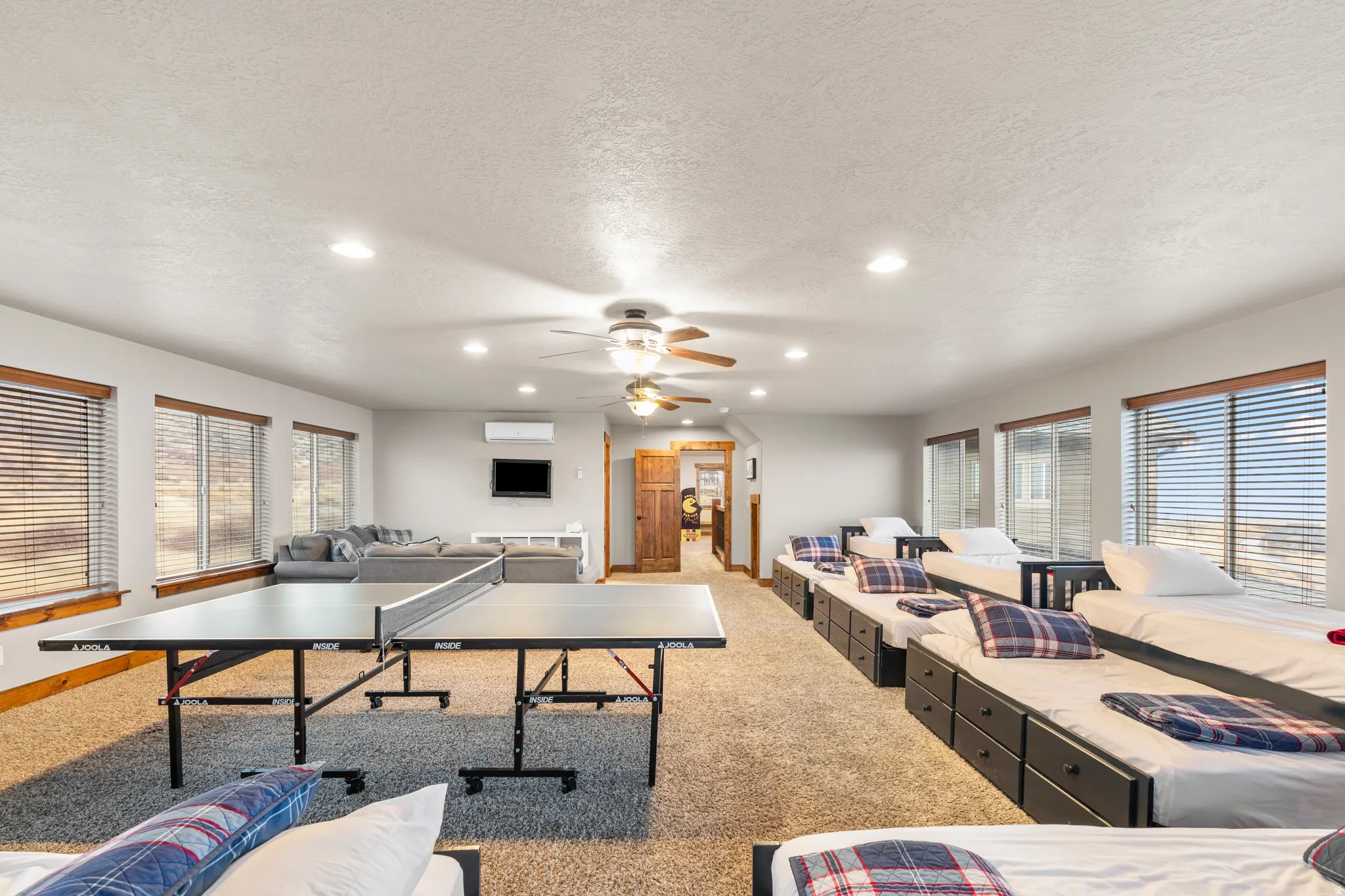 Rec room with recessed lighting, carpet floors, a textured ceiling, and ceiling fan