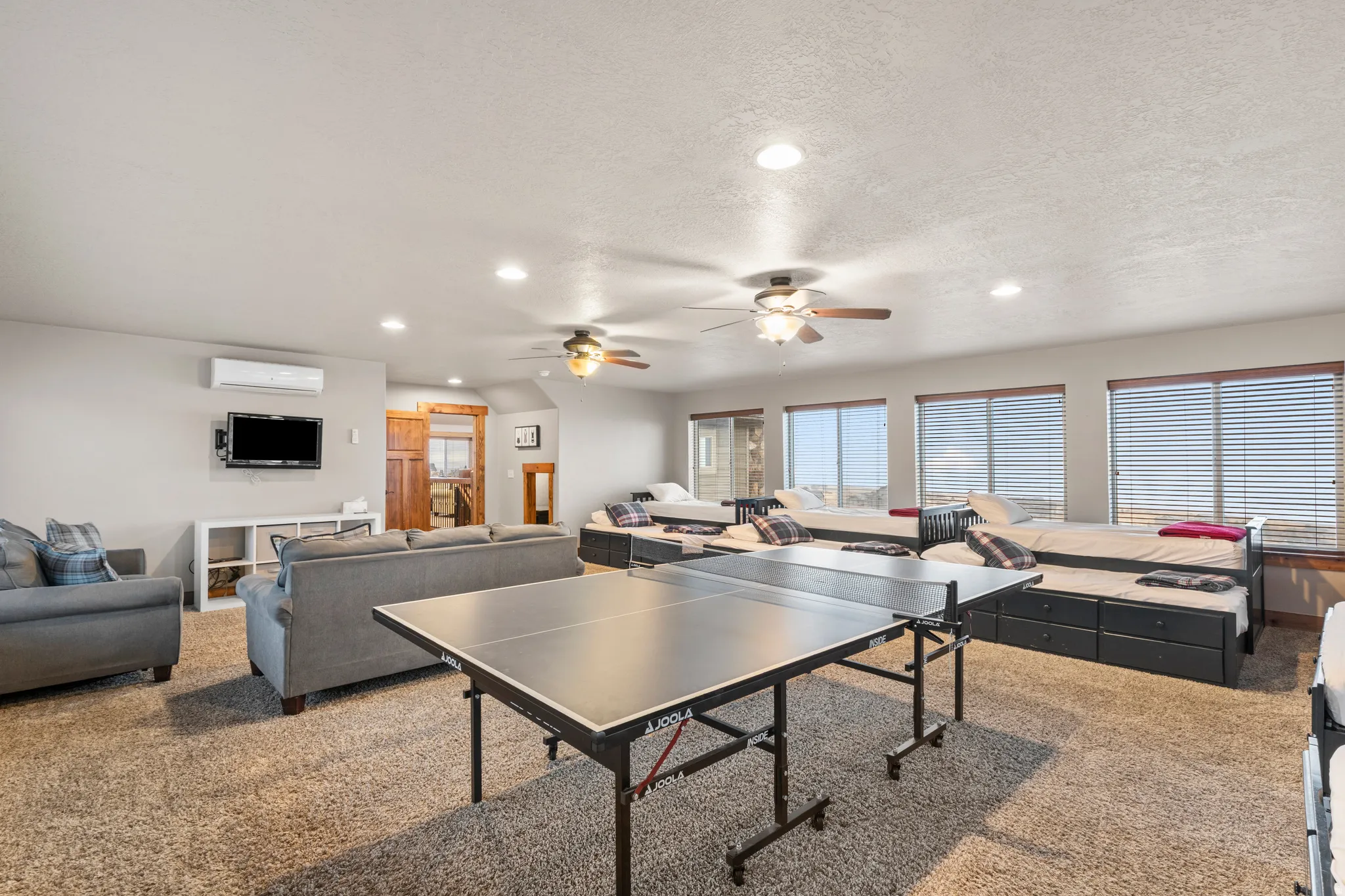 Playroom with recessed lighting, carpet, a ceiling fan, and a textured ceiling
