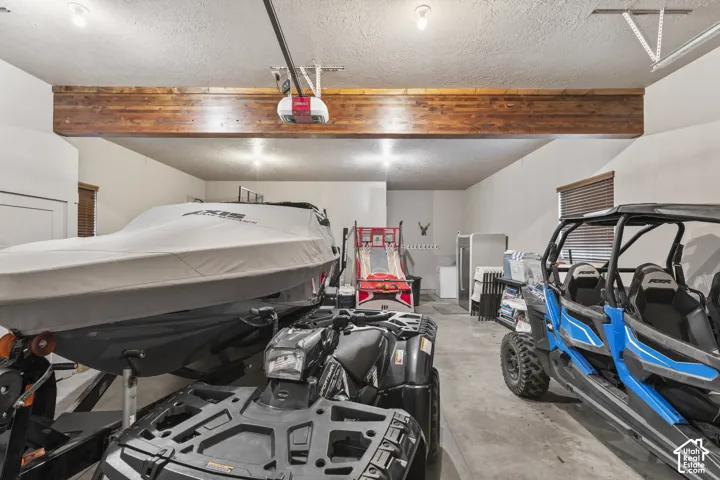 Garage featuring a garage door opener