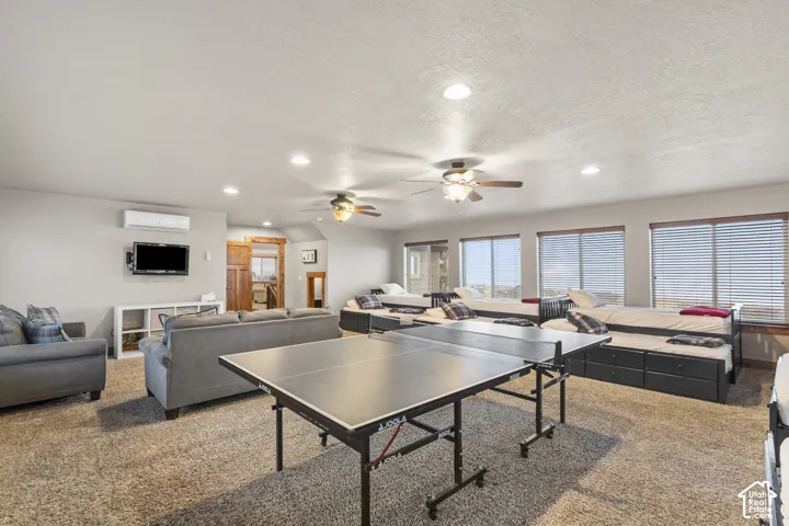 Playroom with recessed lighting, carpet, a ceiling fan, and a textured ceiling