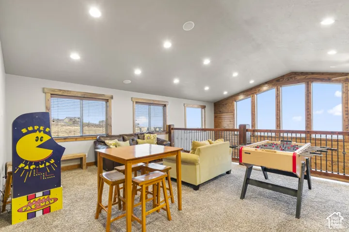 Game room with carpet floors, lofted ceiling, and recessed lighting