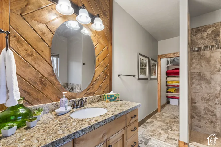 Bathroom featuring vanity and baseboards