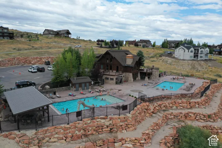 Community pool with a patio