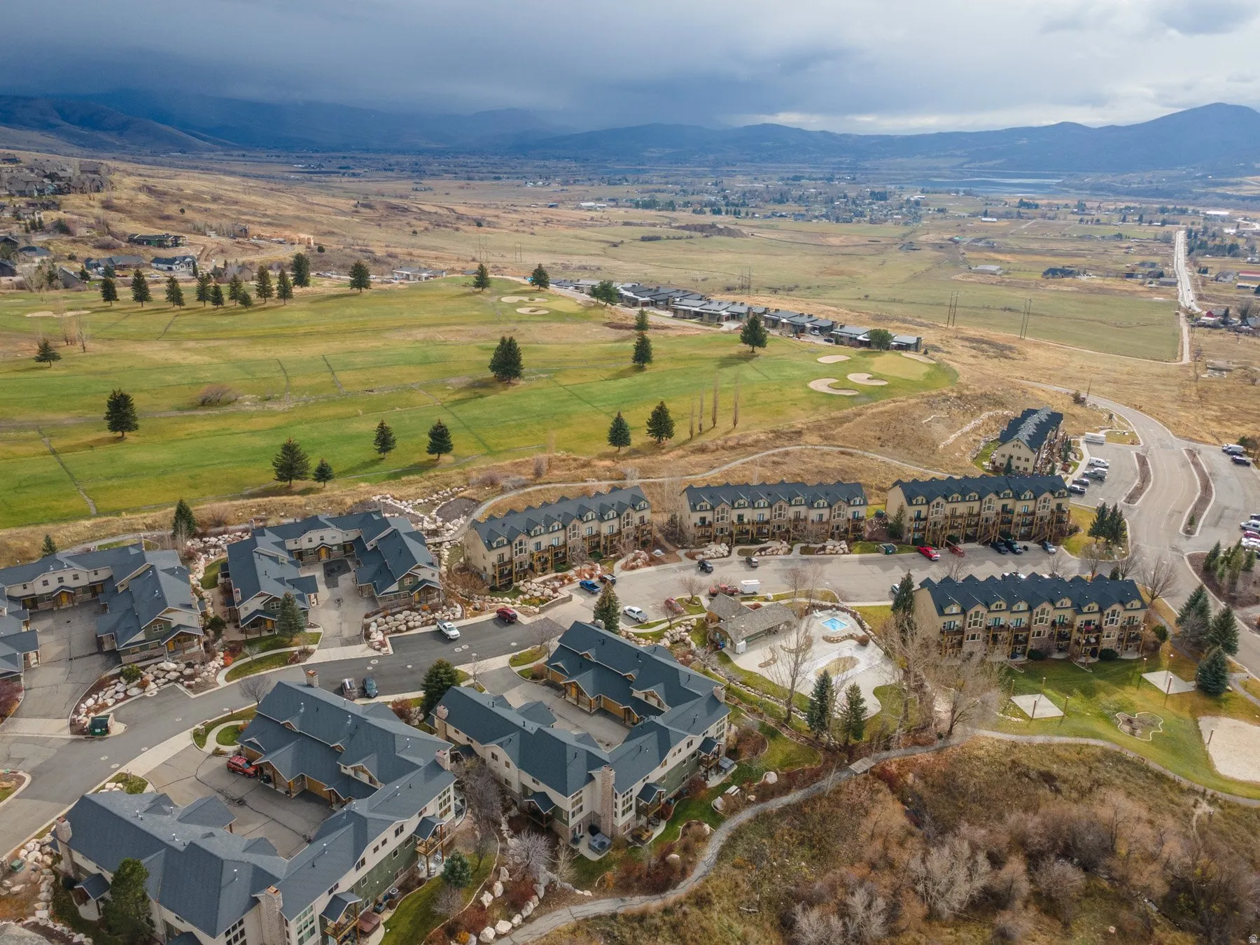View of property location with a mountainous background and nearby suburban area