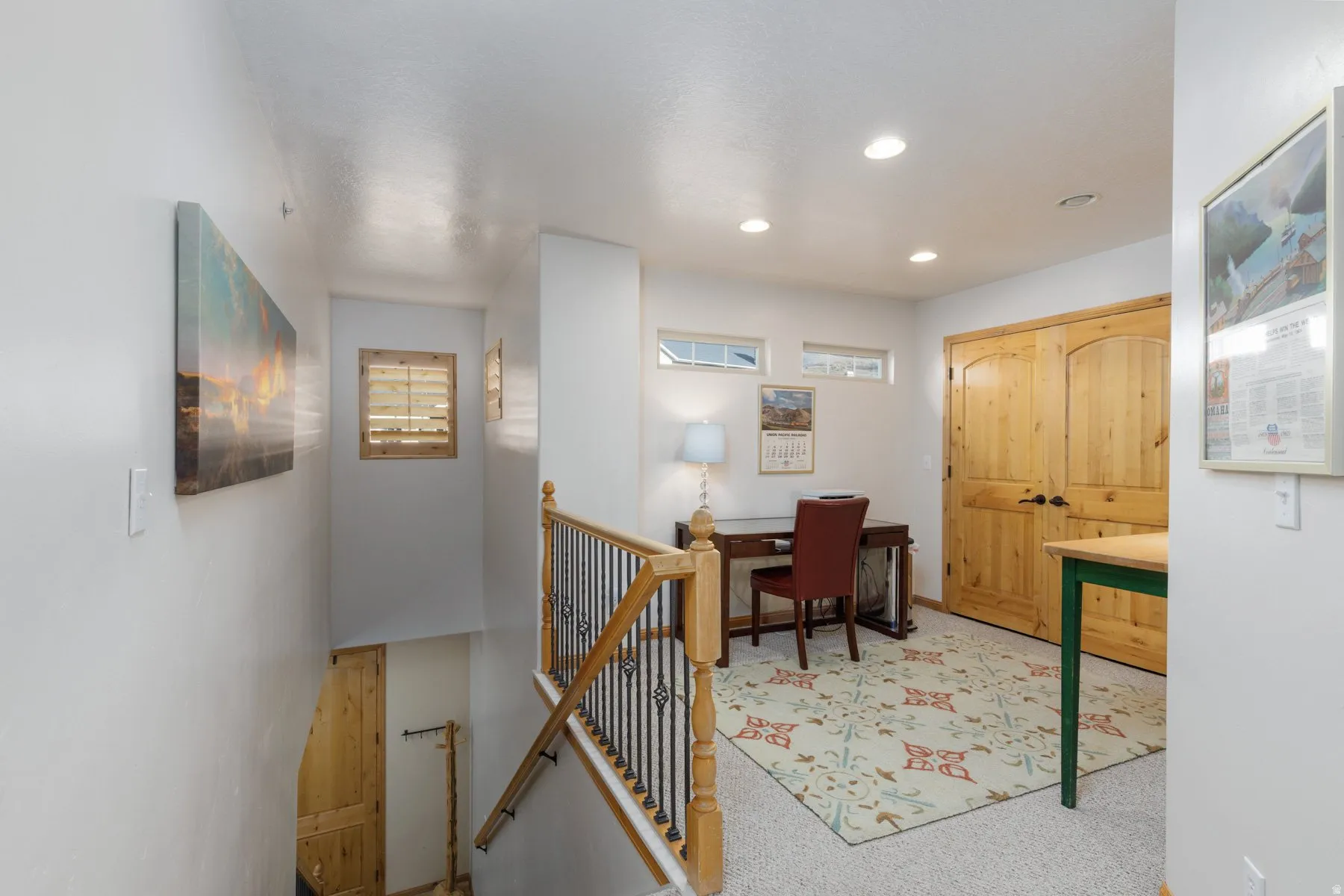 Office area featuring light carpet and recessed lighting