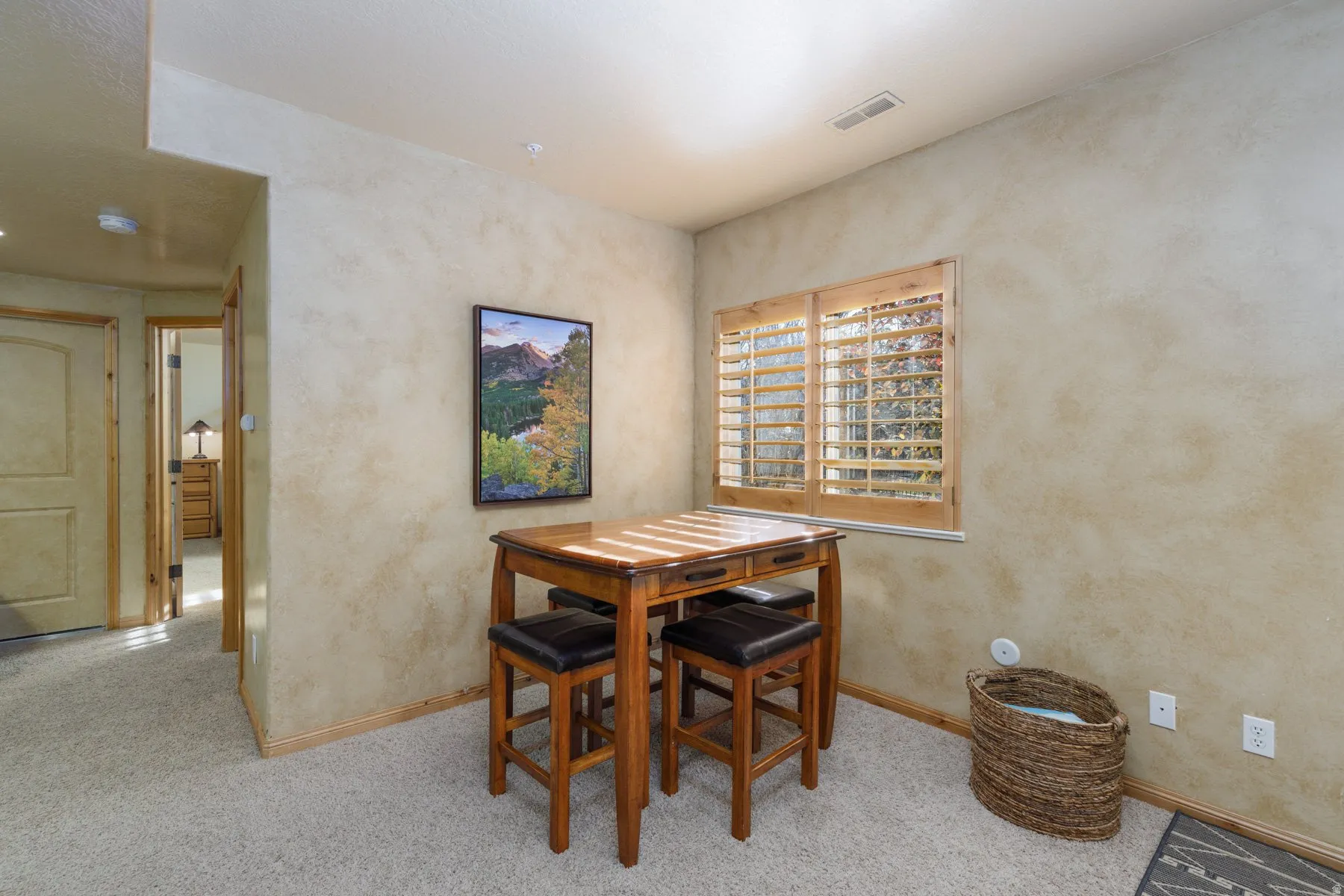 Dining room featuring light carpet