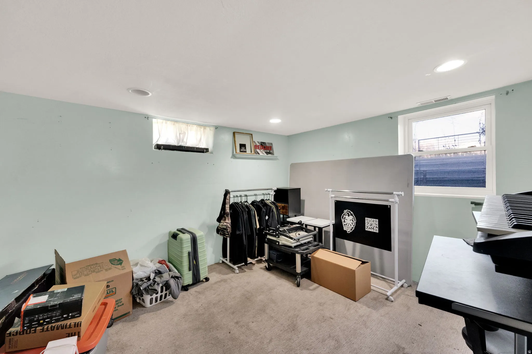 Carpeted office space featuring healthy amount of natural light and recessed lighting