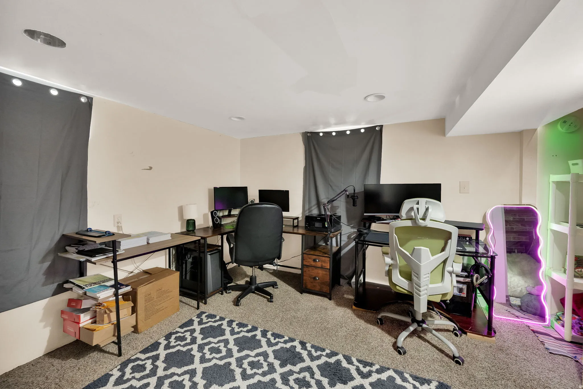 Office area featuring light carpet