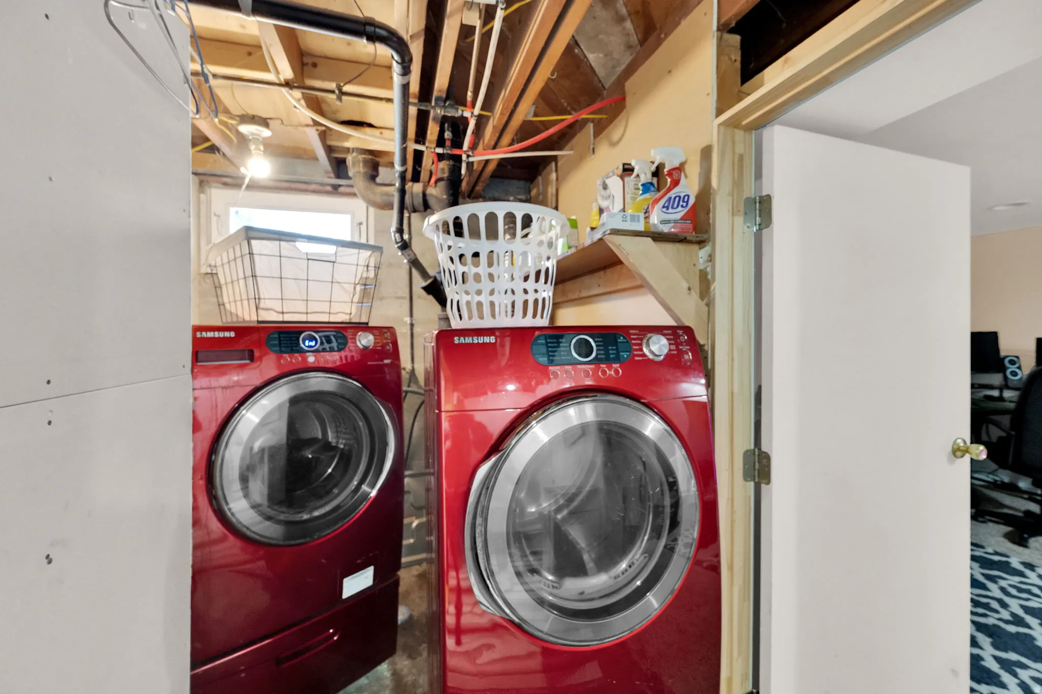 Washroom featuring washing machine and dryer