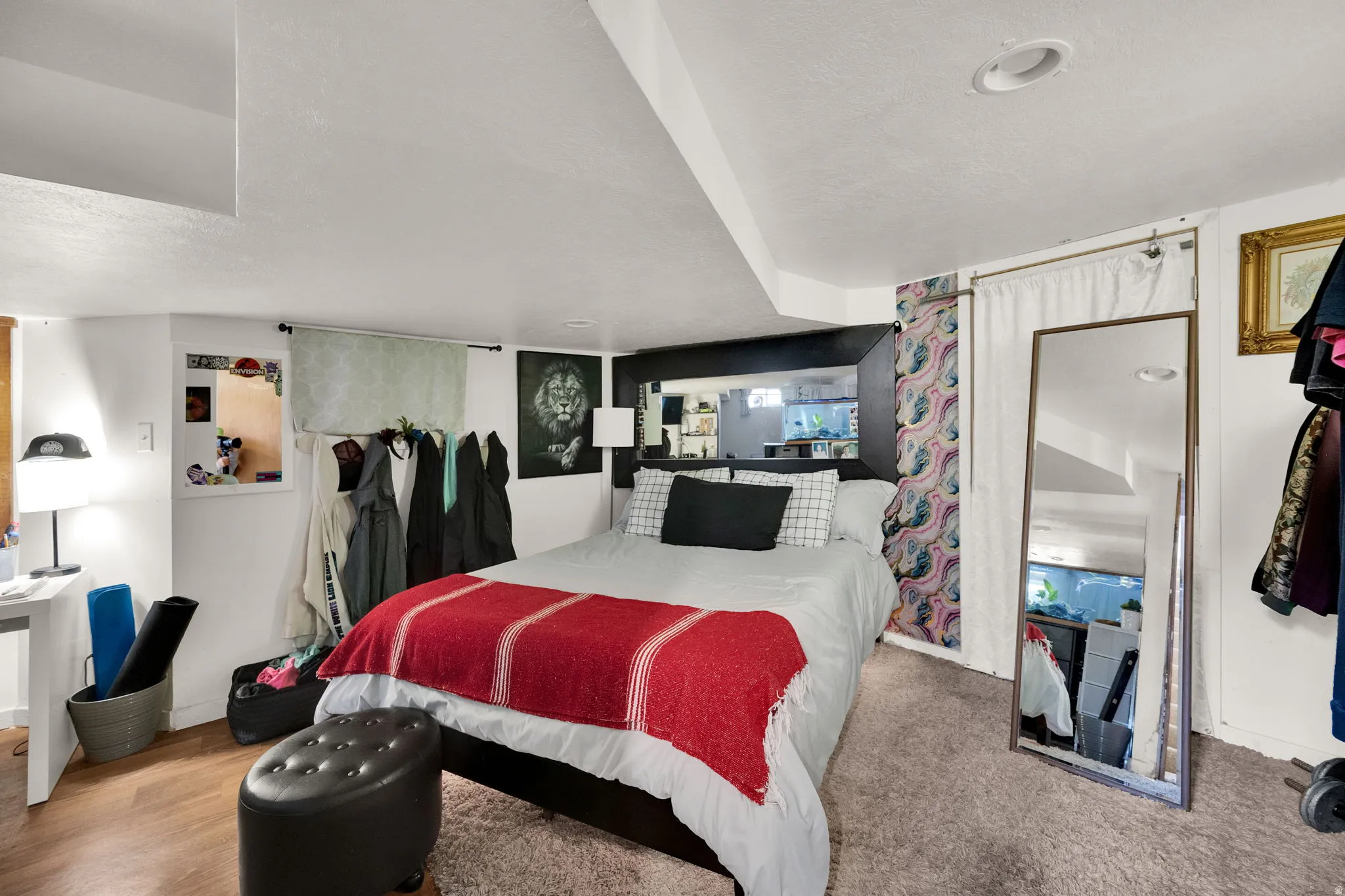 Bedroom featuring a textured ceiling and baseboards