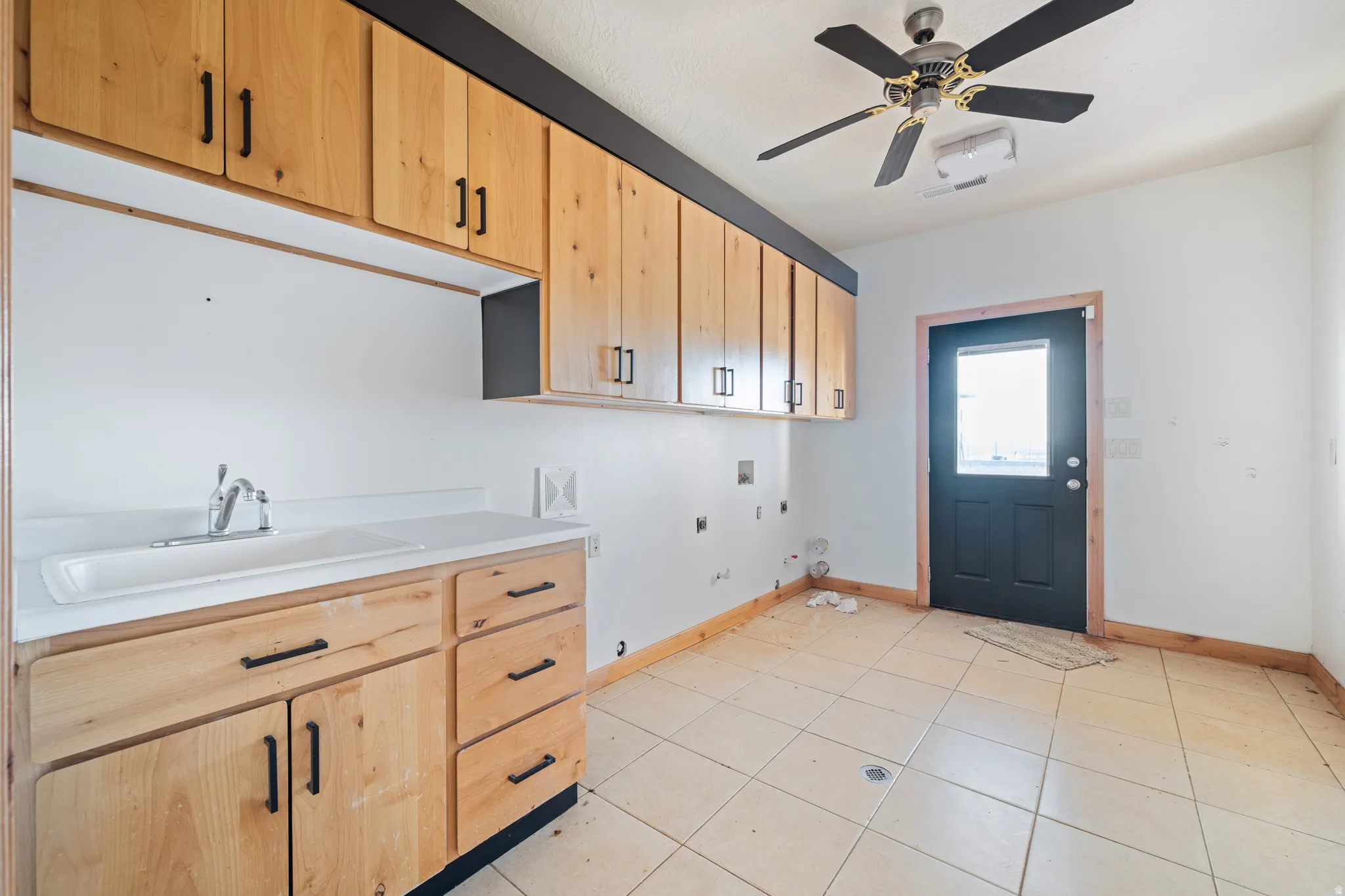 Laundry area featuring gas dryer hookup, hookup for a washing machine, hookup for an electric dryer, a ceiling fan, and cabinet space