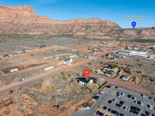 Aerial overview of property's location featuring a mountain backdrop and a desert landscape