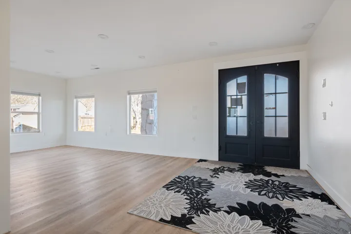 Foyer featuring french doors and wood finished floors