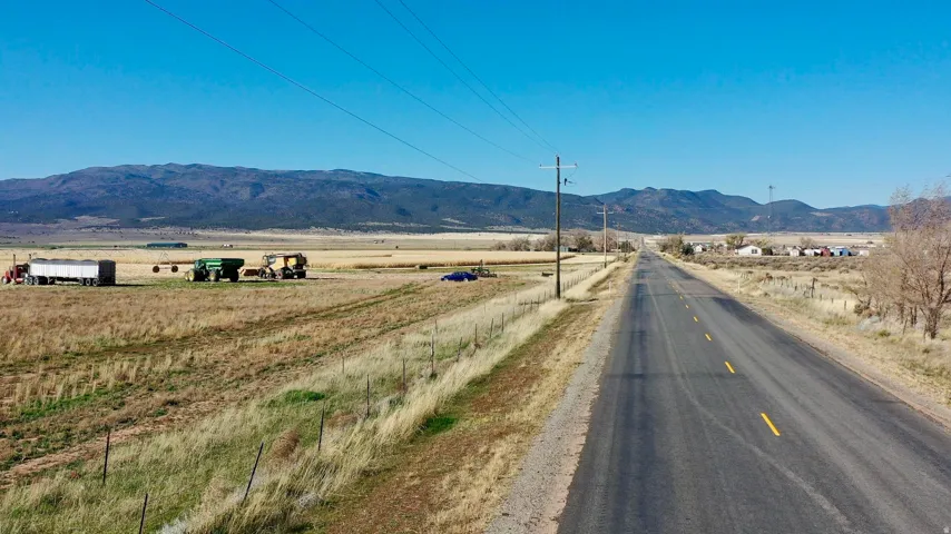 View of mountain background featuring rural landscape
