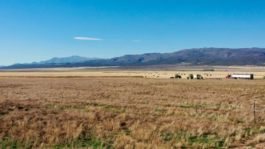 View of mountain background featuring rural landscape