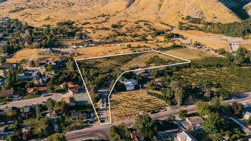 Aerial view of sparsely populated area with property boundaries highlighted and abundant farmland