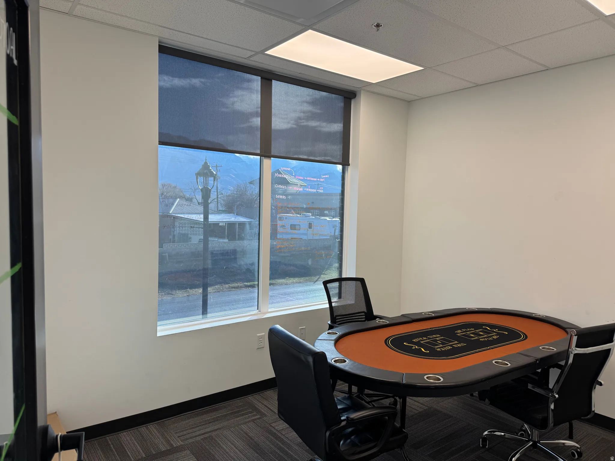 Office area with a paneled ceiling