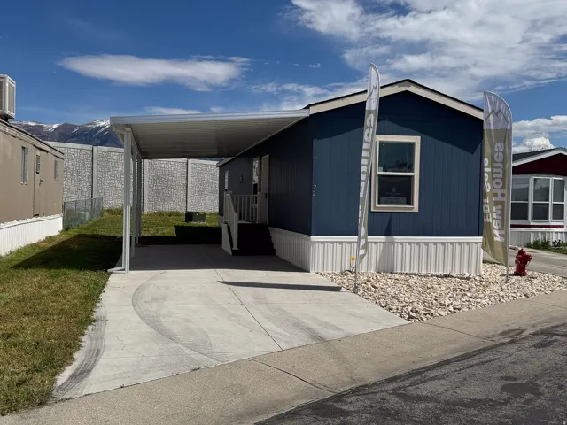 View of front of home featuring a carport