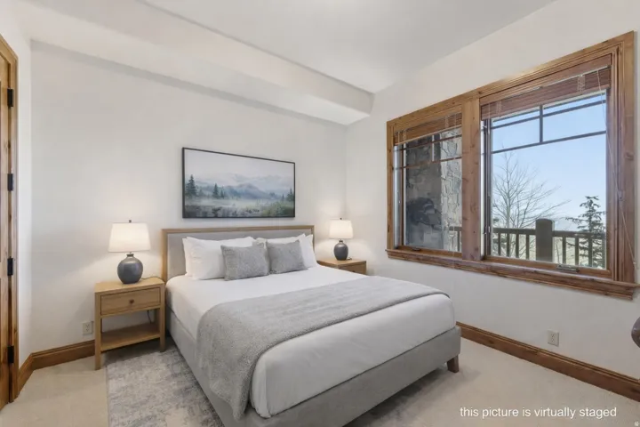 Bright room with light-colored walls and carpet flooring