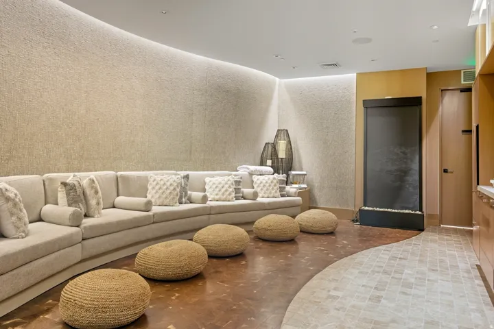 Curved textured wall with cove lighting
