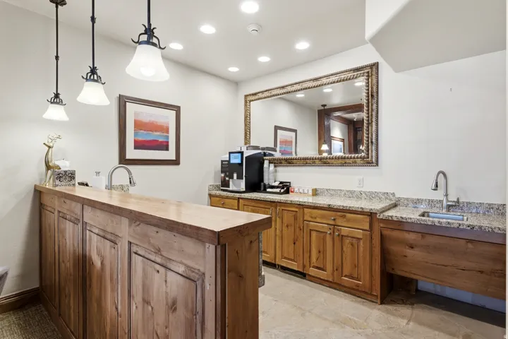 Wood-finish bar with a built-in sink and faucet