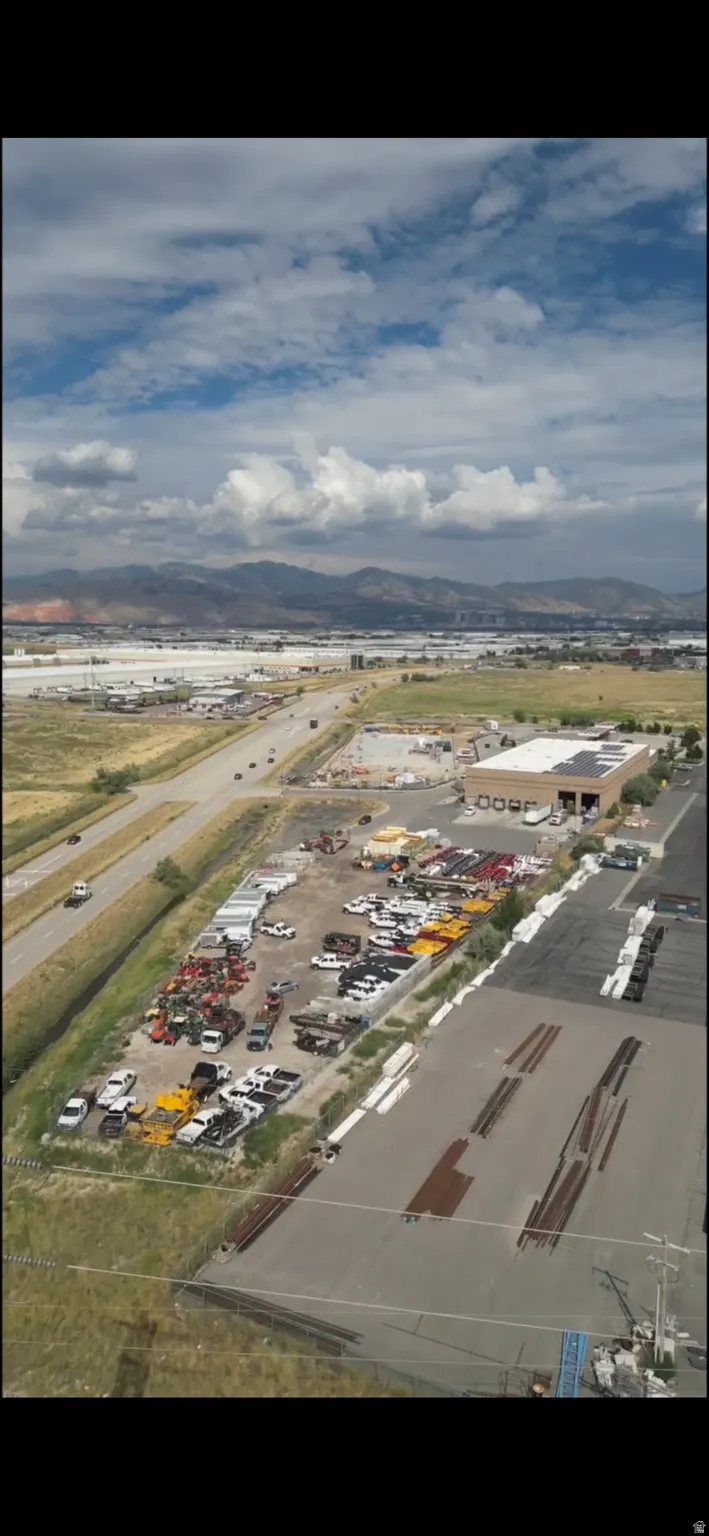 Bird's eye view of an industrial area and a mountain backdrop