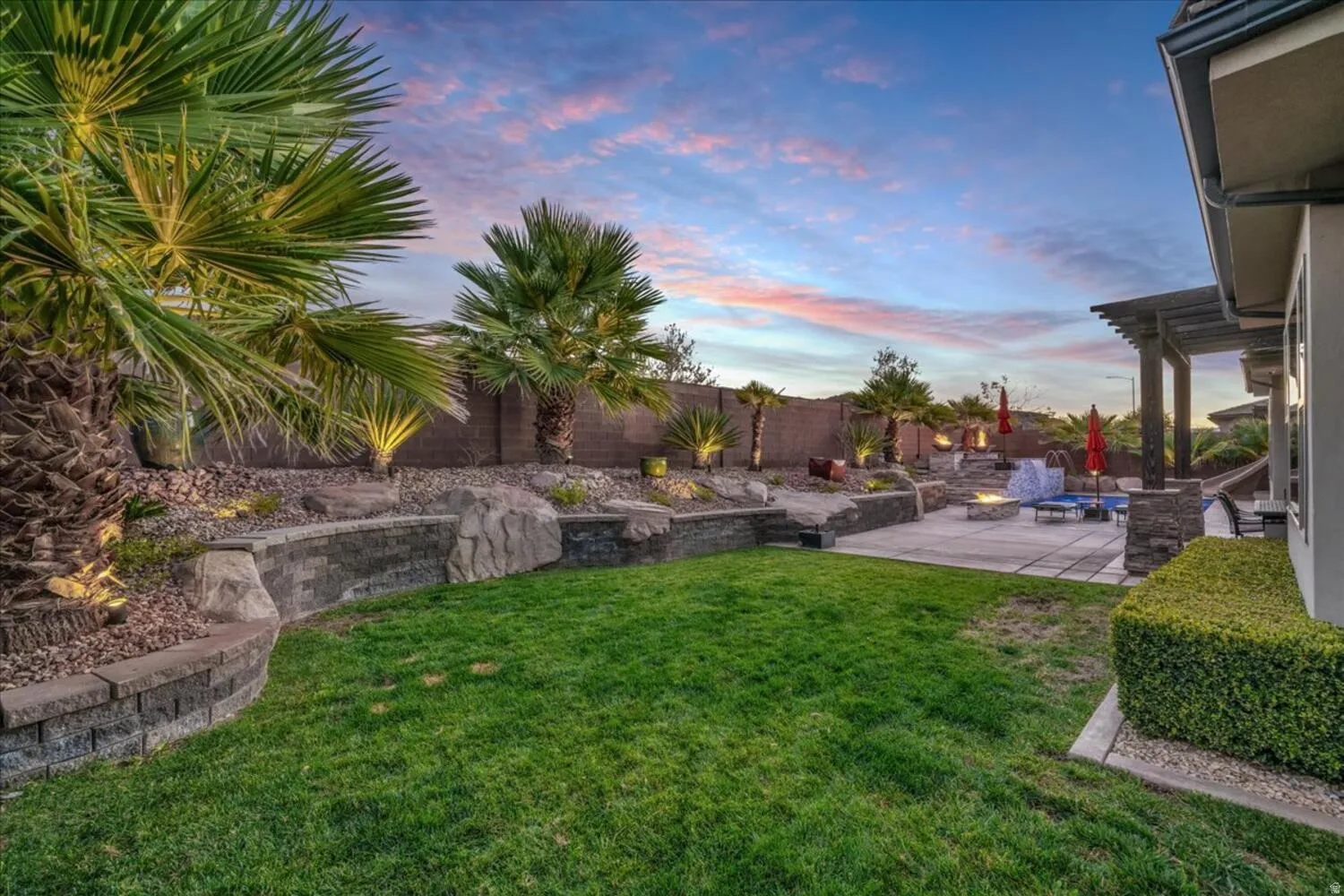 Fenced backyard with a patio
