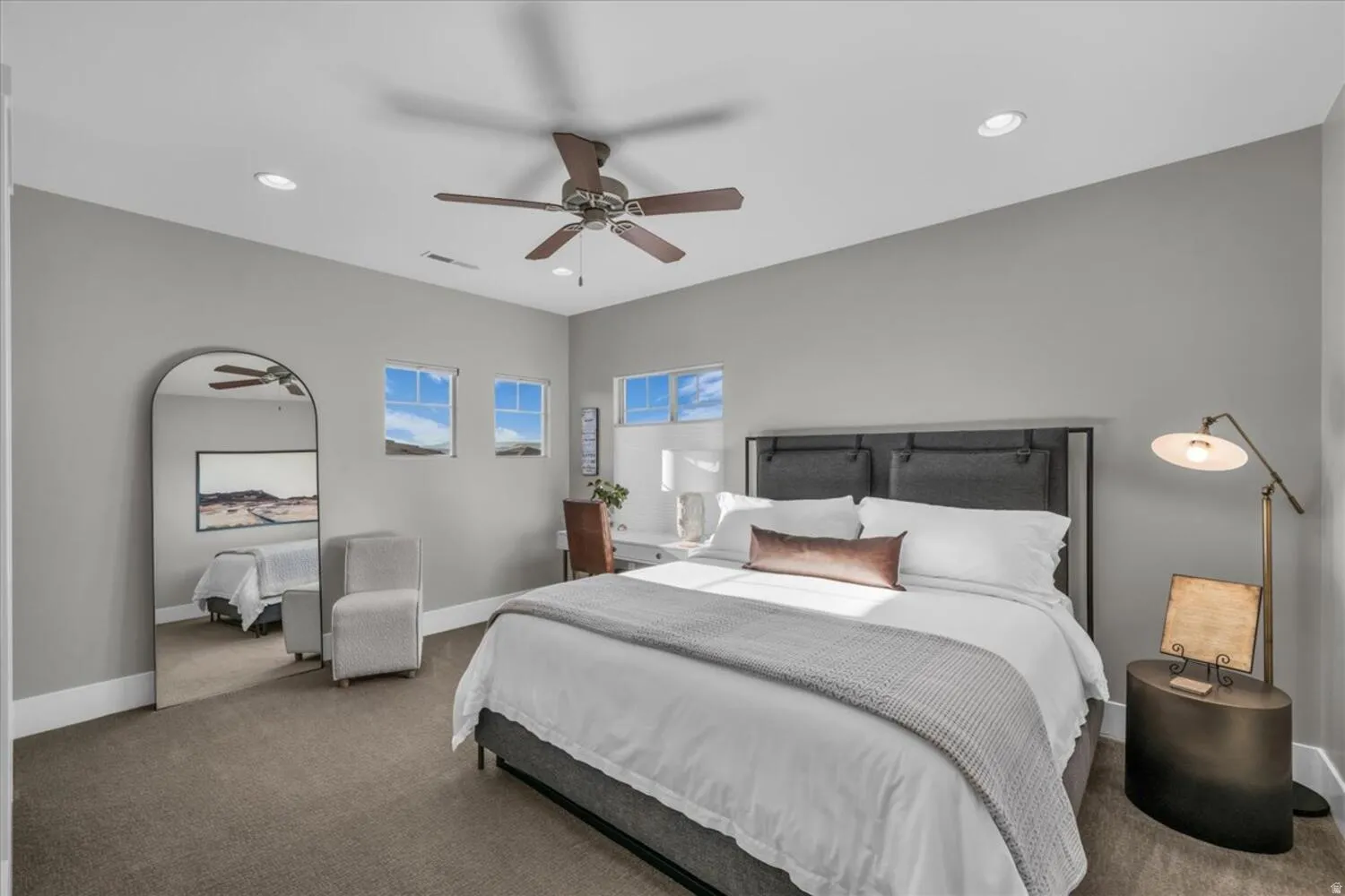 Carpeted bedroom featuring recessed lighting and ceiling fan