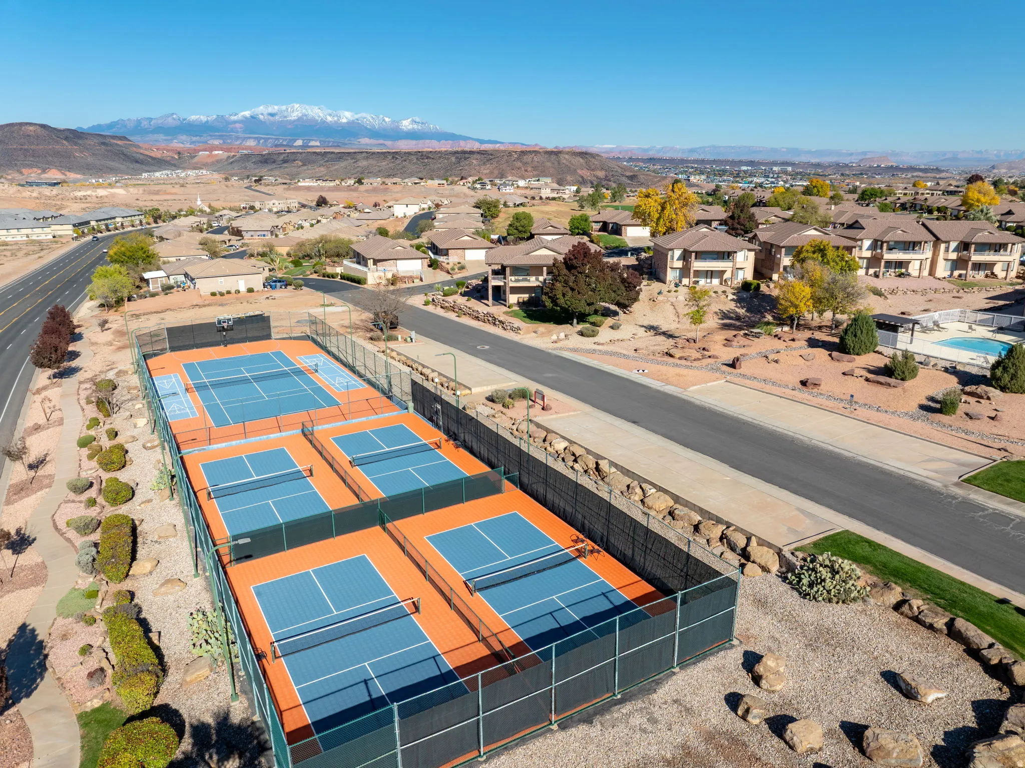 Aerial view of residential area featuring mountains