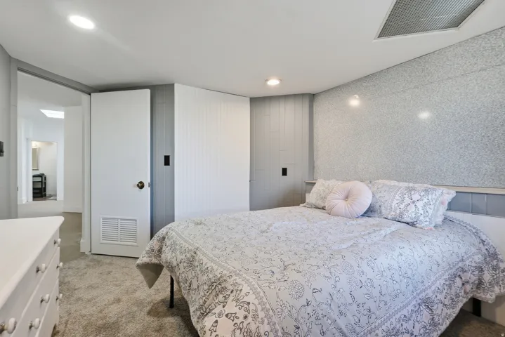 Bedroom featuring light colored carpet and recessed lighting