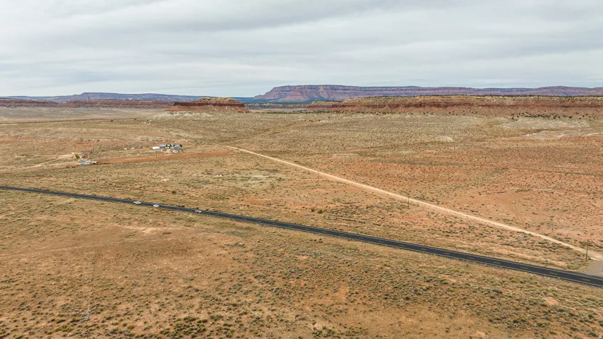 View of rural area featuring mountains and a desert landscape