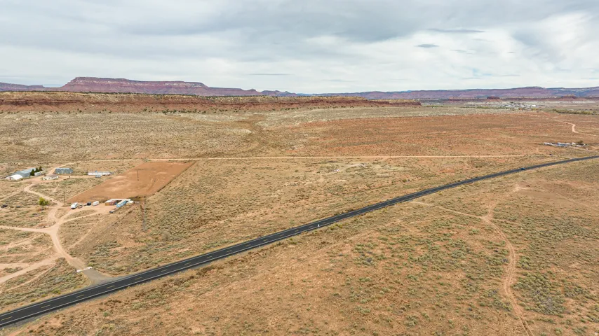 View of rural area with a mountainous background and a desert landscape