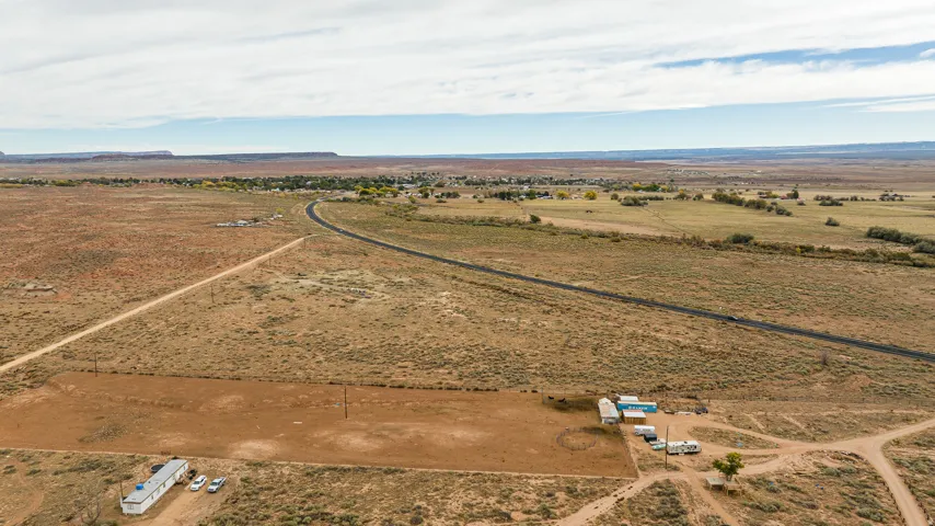 Aerial view of property and surrounding area featuring rural landscape