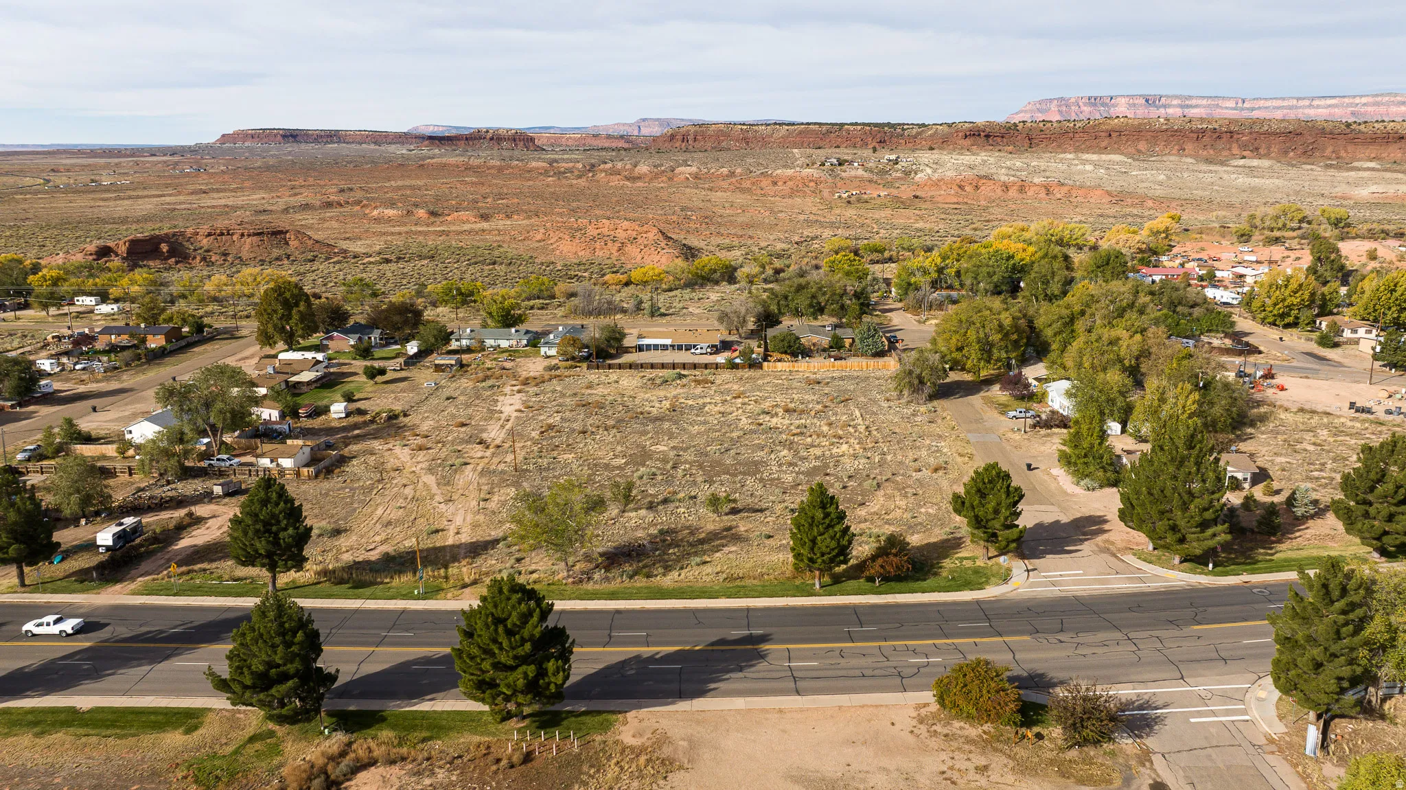Aerial view of property and surrounding area with a mountainous background