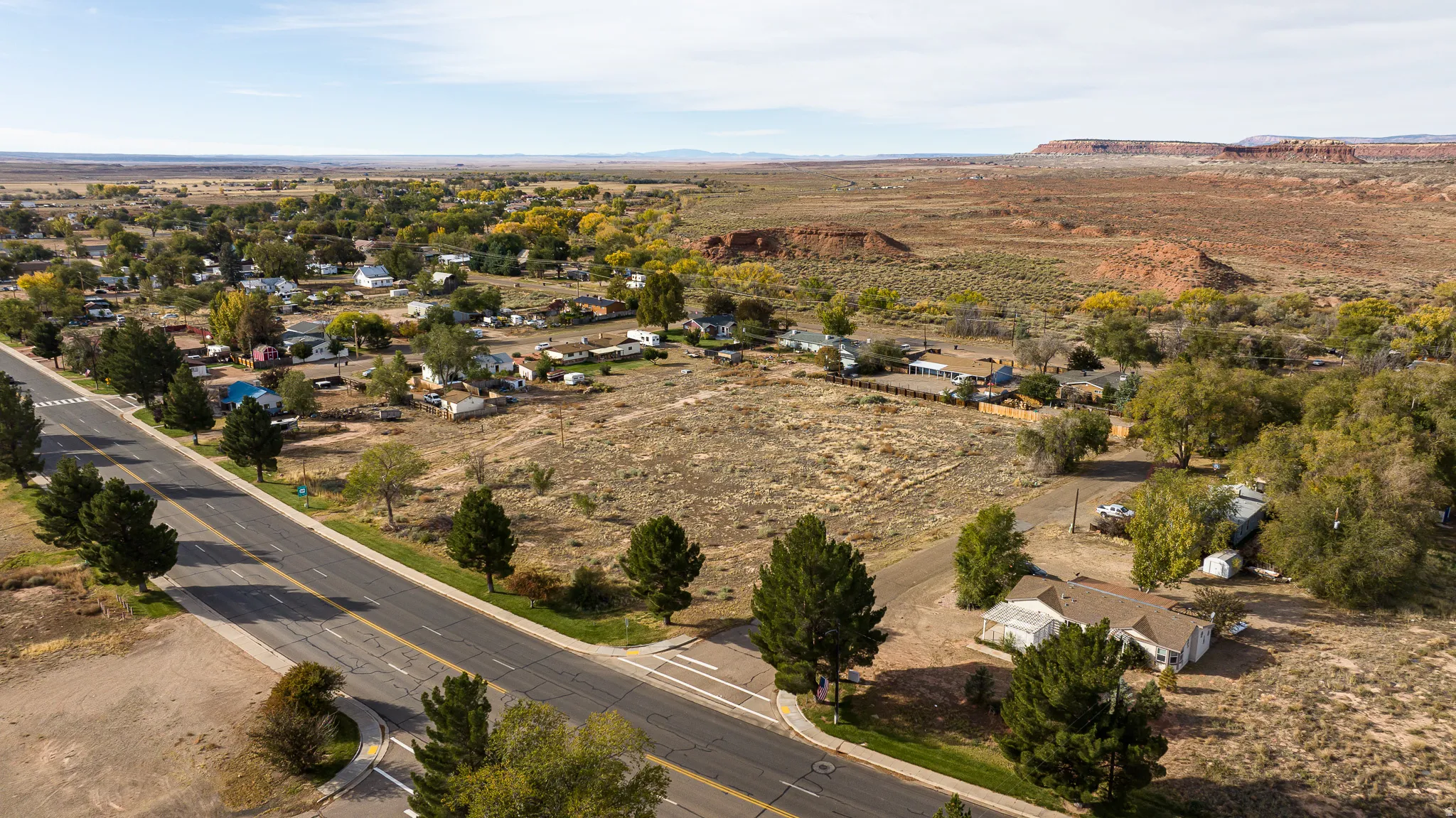 Aerial view of property's location with a mountainous background and rural landscape