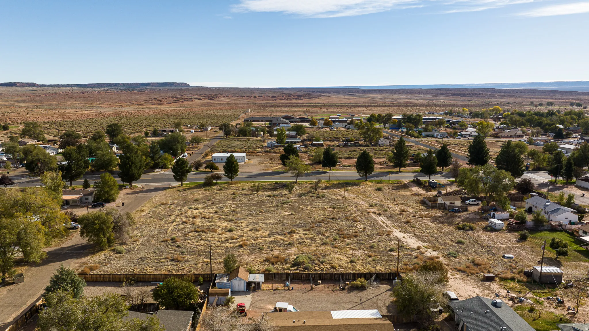 View of rural area with a desert landscape and a mountainous background