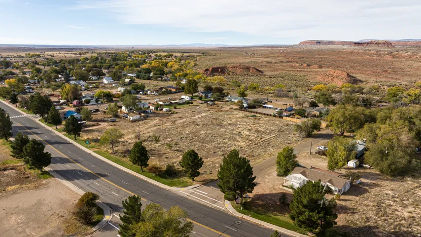 Aerial view of property's location with a mountainous background and rural landscape