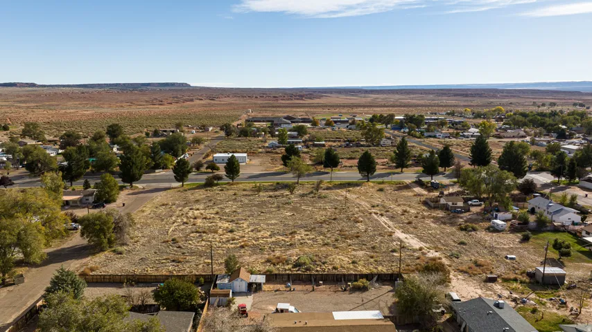 View of rural area with a desert landscape and a mountainous background