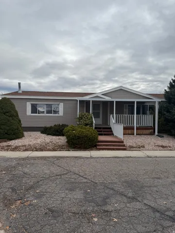 This beautifully maintained home boasts a spacious covered porch and a yard that requires minimal upkeep.