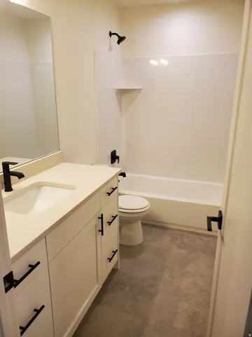 Full bathroom featuring vanity and bathtub / shower combination