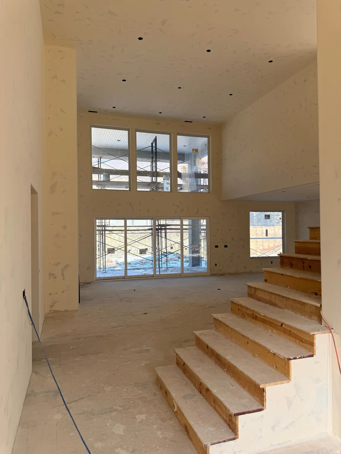 Stairs featuring a high ceiling