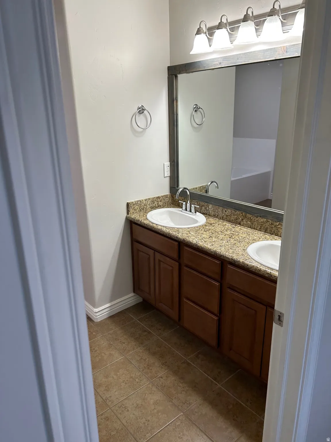 Full bathroom with double vanity
