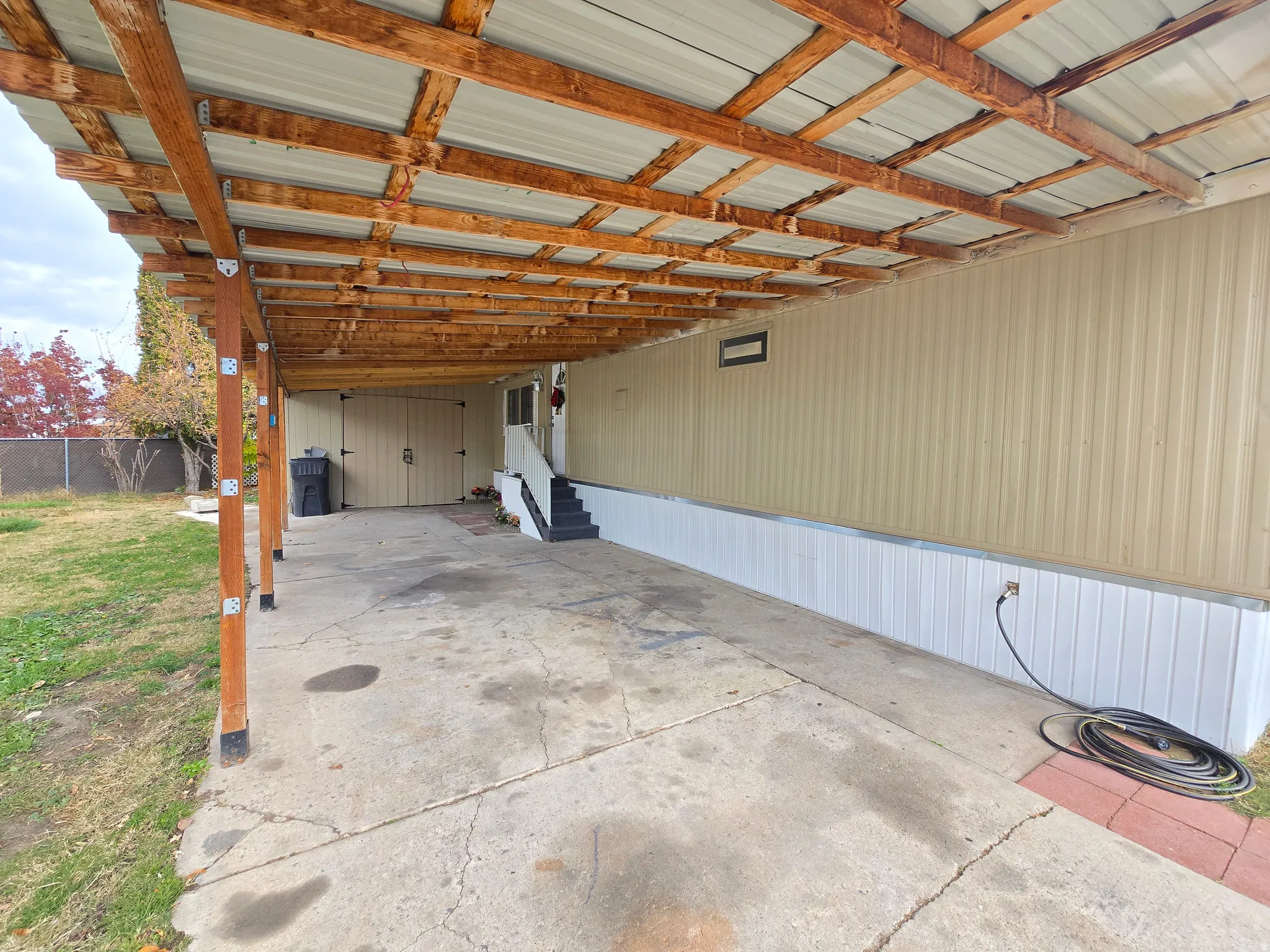 Garage featuring a carport