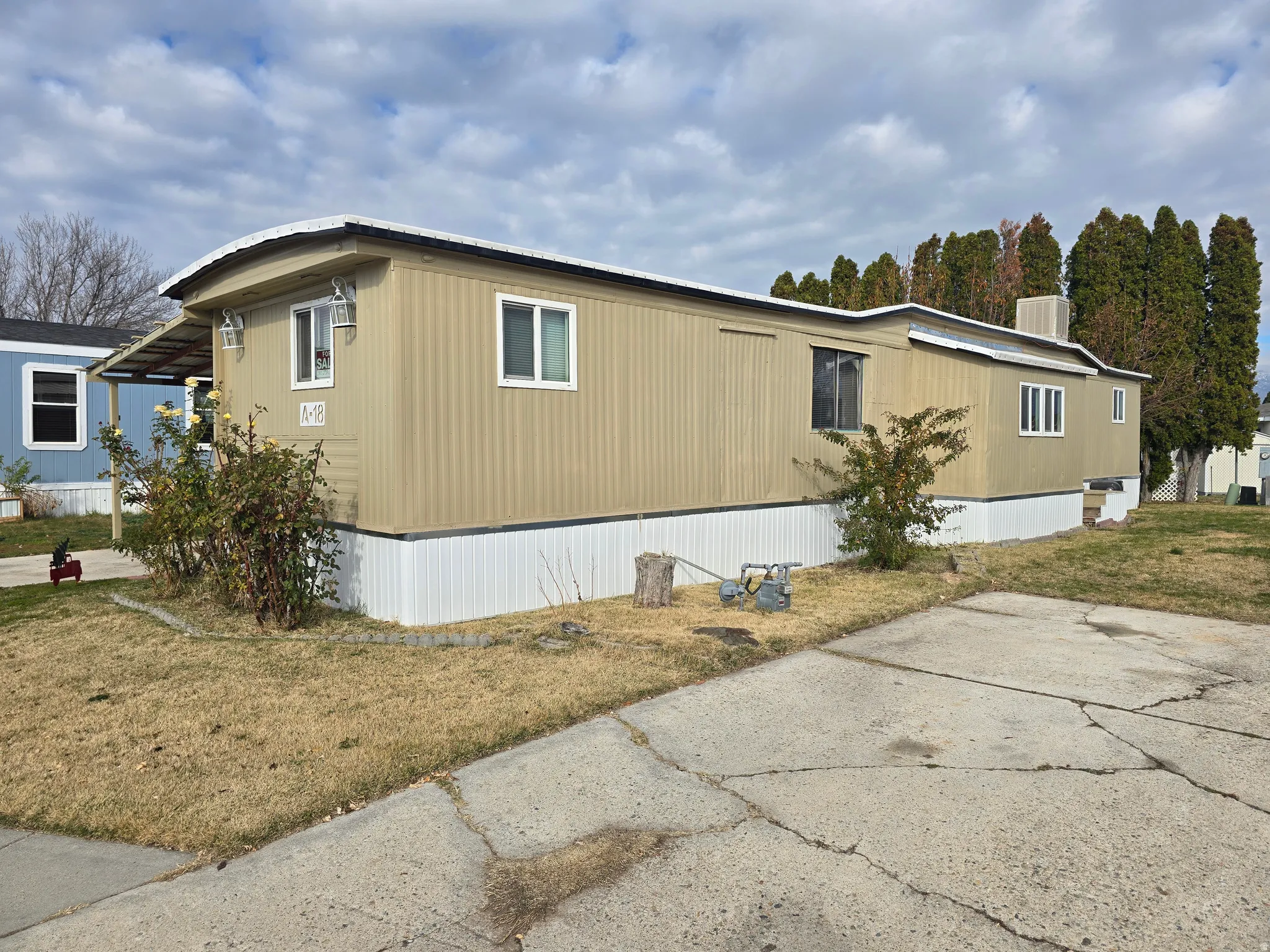 View of home's exterior with a lawn and a central air condition unit
