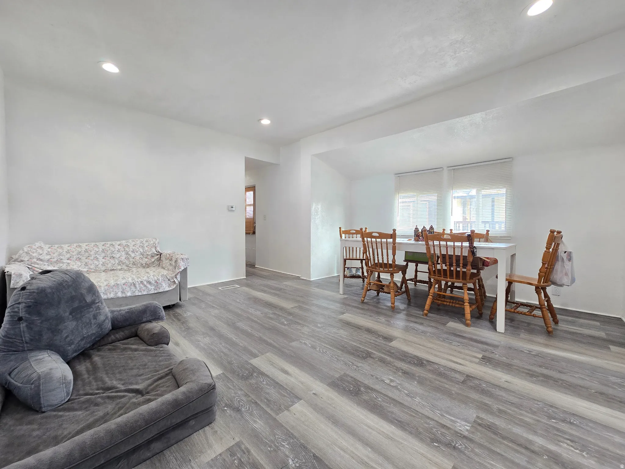 Living area featuring recessed lighting and wood finished floors