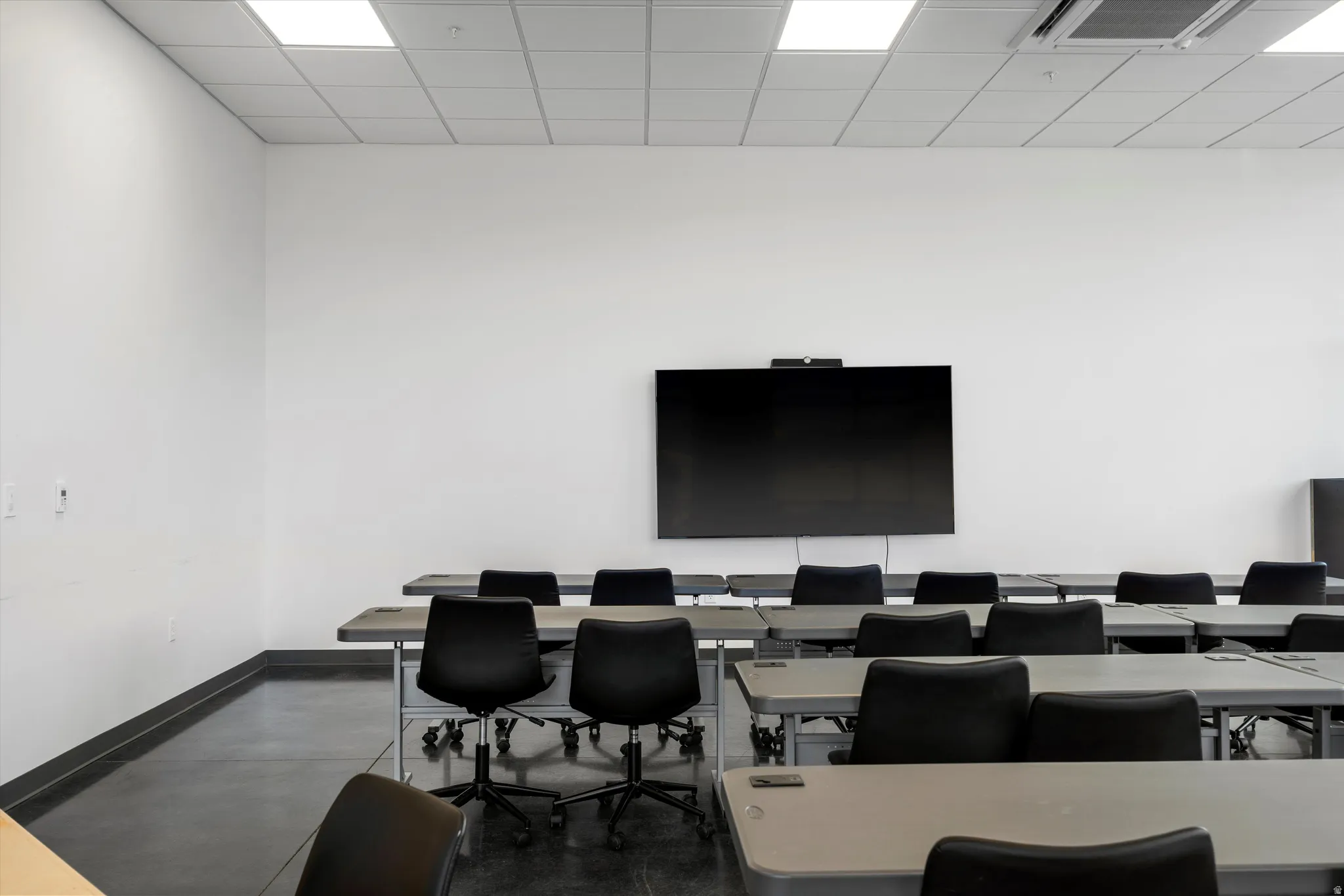 Office space with a paneled ceiling