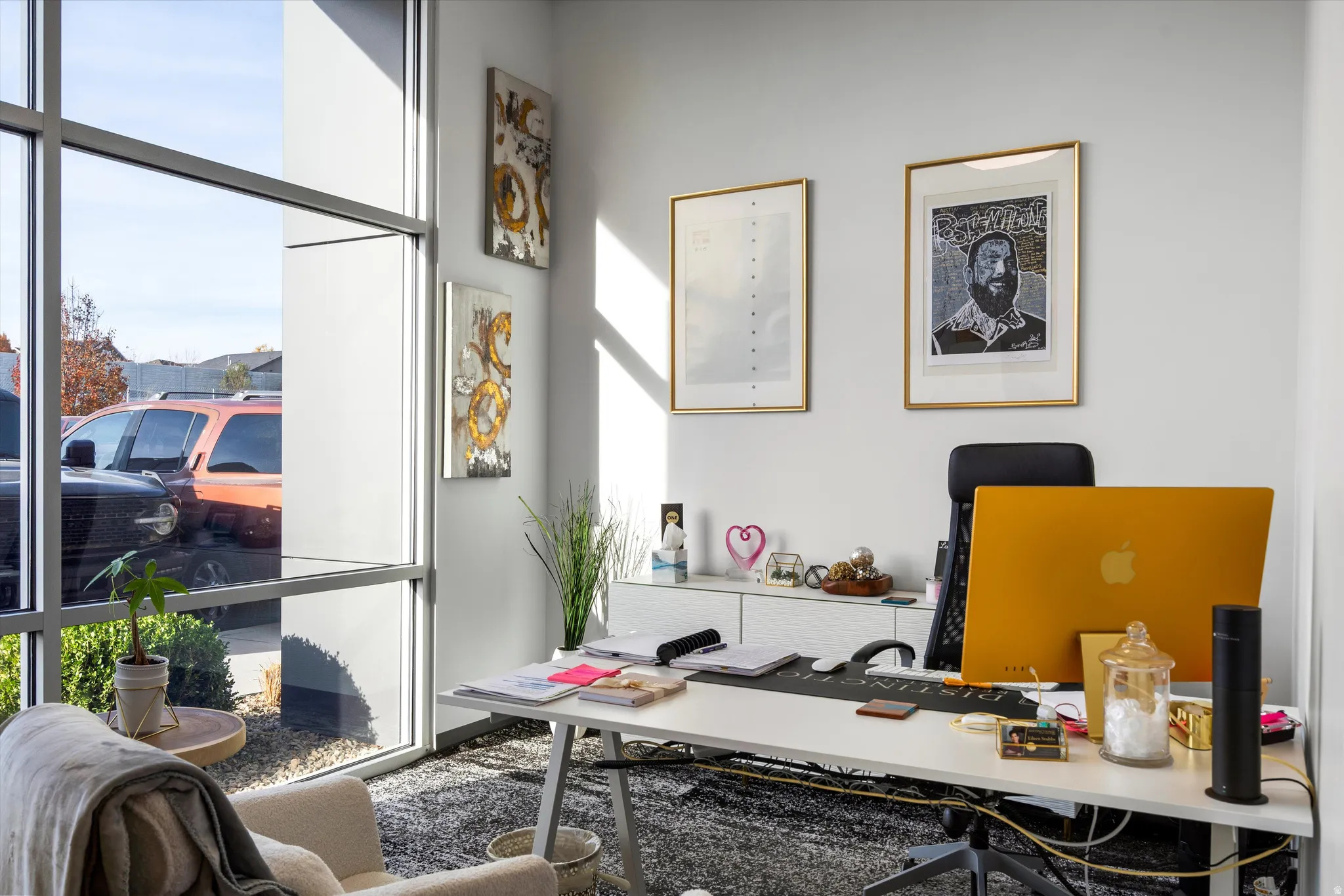 Private office featuring plenty of natural light and a wall of windows