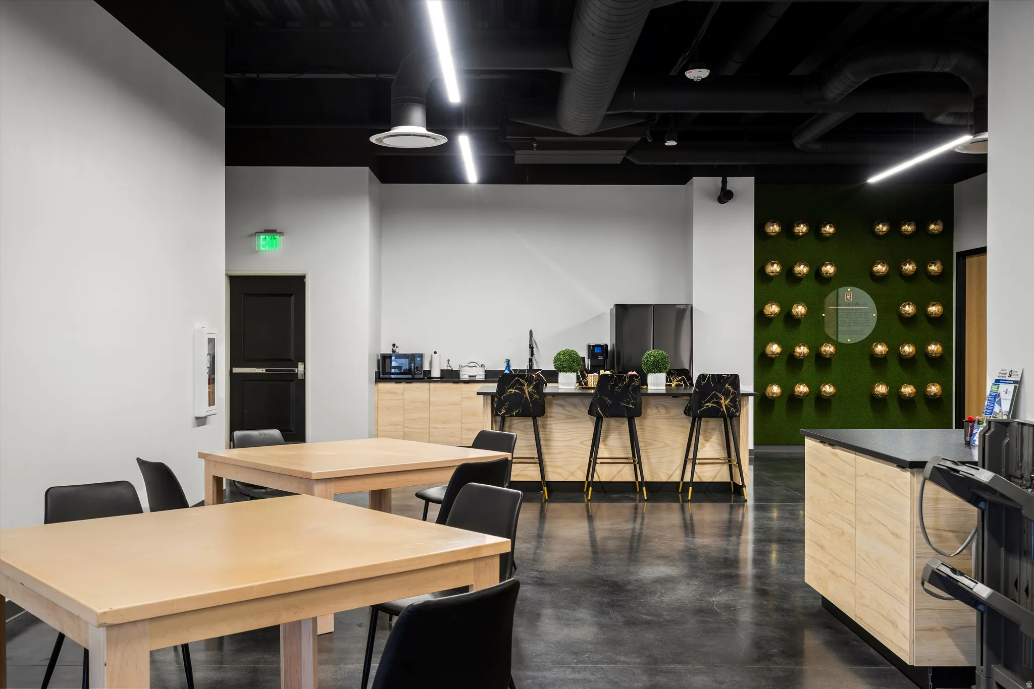 Breakroom space featuring finished concrete flooring
