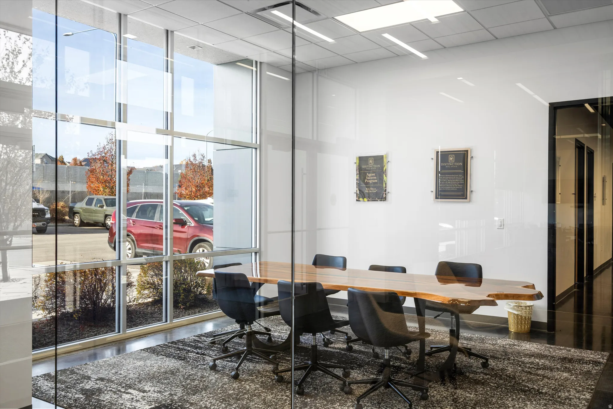Conference Room featuring floor to ceiling windows and a paneled ceiling